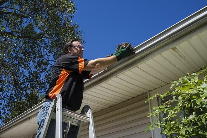rain gutter being fixed to prevent water leakage in Glenwood MD
